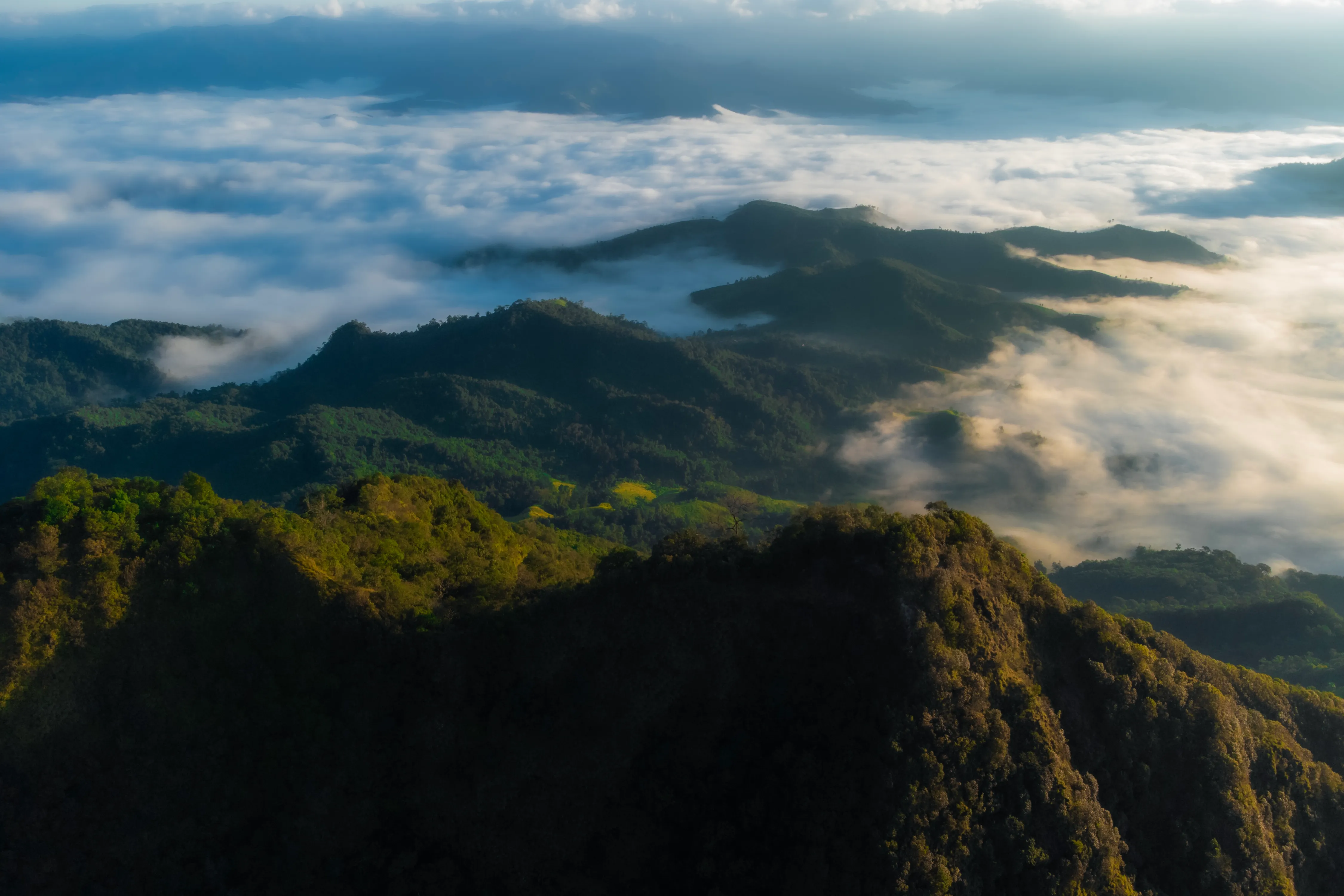 Mountain ridges and mist over a valley